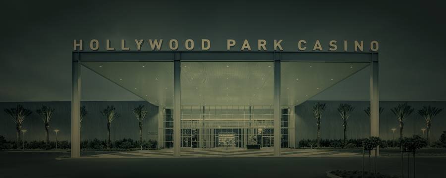 The lit entrance and signage at Hollywood Park Casino in Inglewood, California